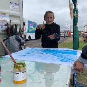 Youngster Making A Flag